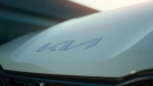 Kia CV teaser new Kia logo
