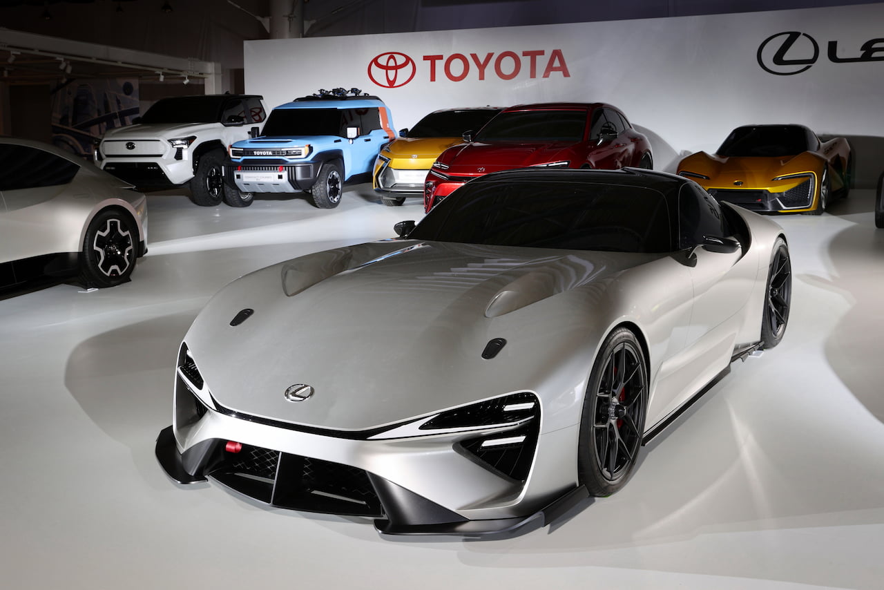 The gray electric Lexus LFA Supercar is in a car showroom beside other unreleased vehicles. (Toyota Motor Corporation. 2021.)