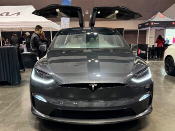 Stealth Grey 2024 Tesla Model X flaps its Falcon wing doors